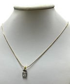 14kt Yellow Gold Chain with a 0.60ctw Diamond and 18kt White Gold Pendant
