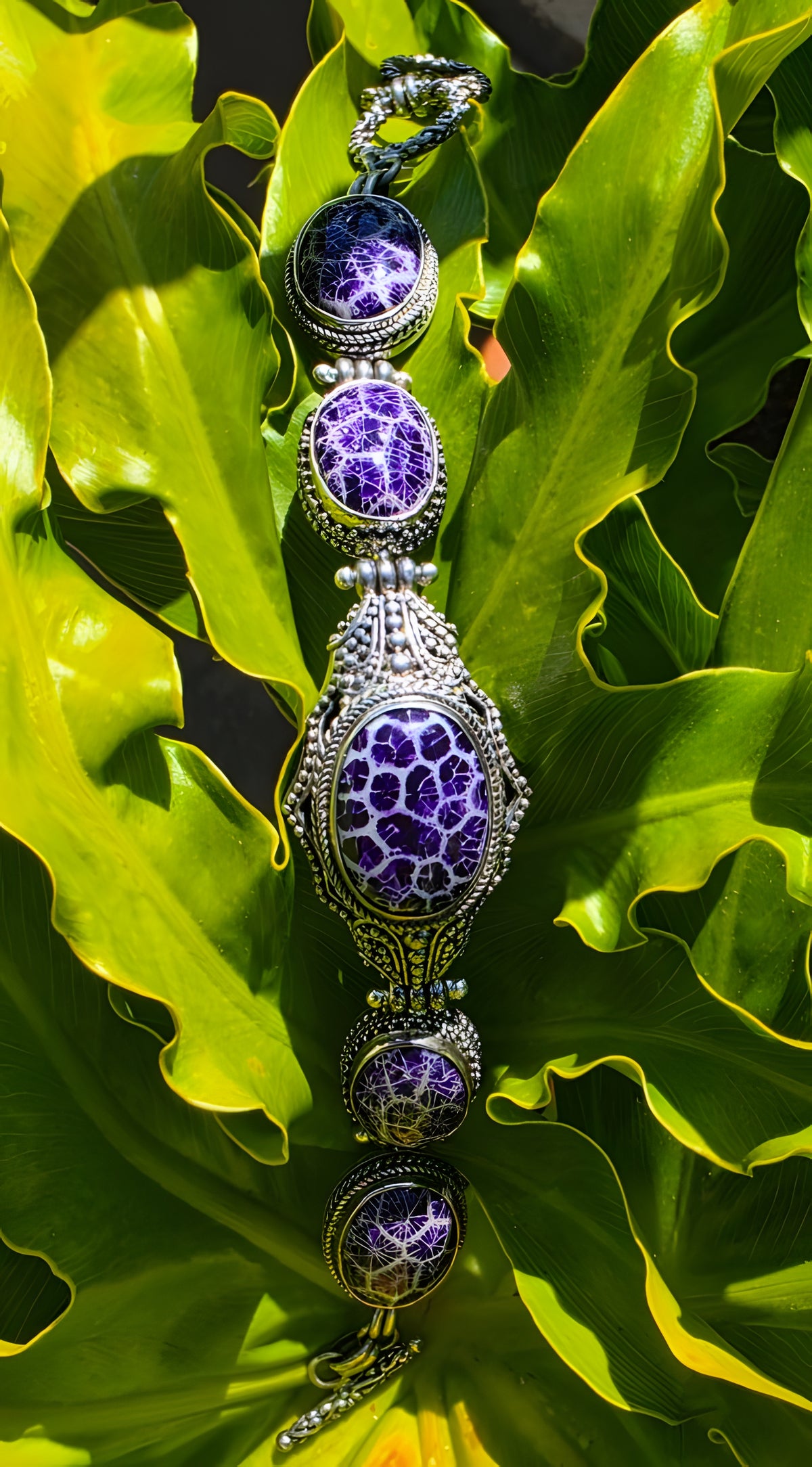 Beautiful SARDA sterling silver link bracelet featuring five oval purple cabocho