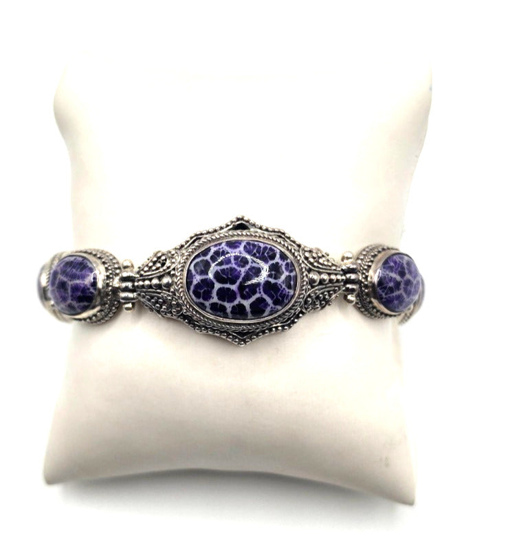 Beautiful SARDA sterling silver link bracelet featuring five oval purple cabocho