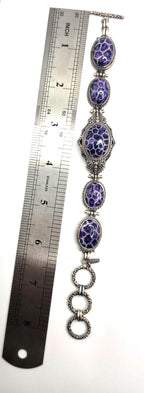 Beautiful SARDA sterling silver link bracelet featuring five oval purple cabocho