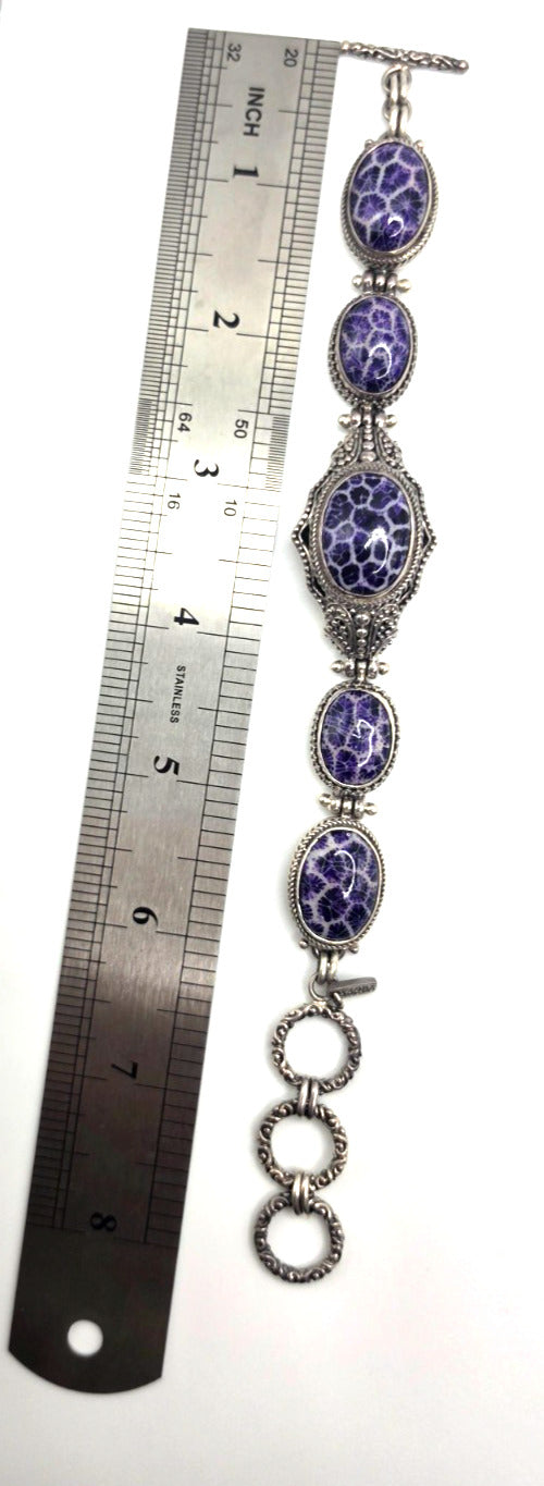 Beautiful SARDA sterling silver link bracelet featuring five oval purple cabocho