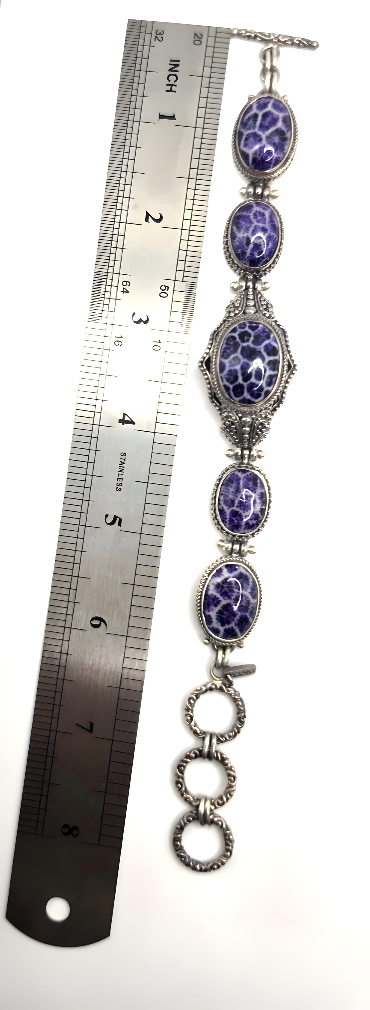 Beautiful SARDA sterling silver link bracelet featuring five oval purple cabocho