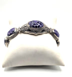 Beautiful SARDA sterling silver link bracelet featuring five oval purple cabocho
