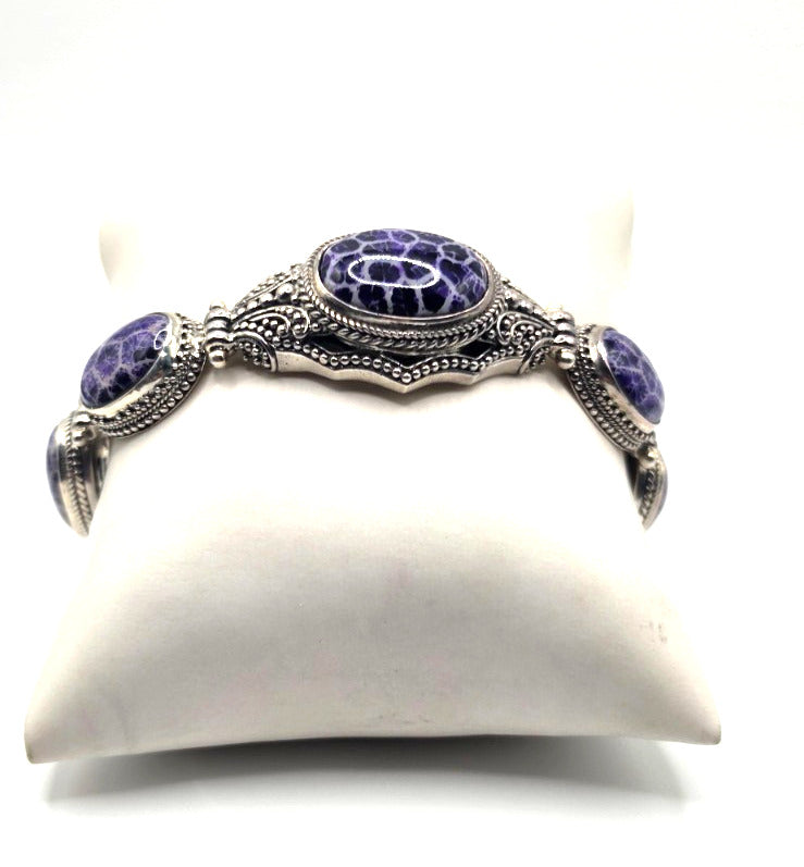 Beautiful SARDA sterling silver link bracelet featuring five oval purple cabocho