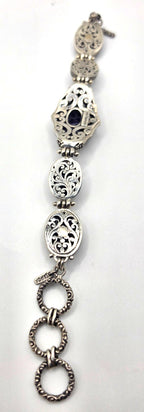 Beautiful SARDA sterling silver link bracelet featuring five oval purple cabocho