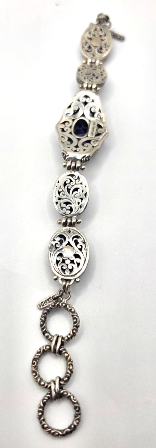 Beautiful SARDA sterling silver link bracelet featuring five oval purple cabocho