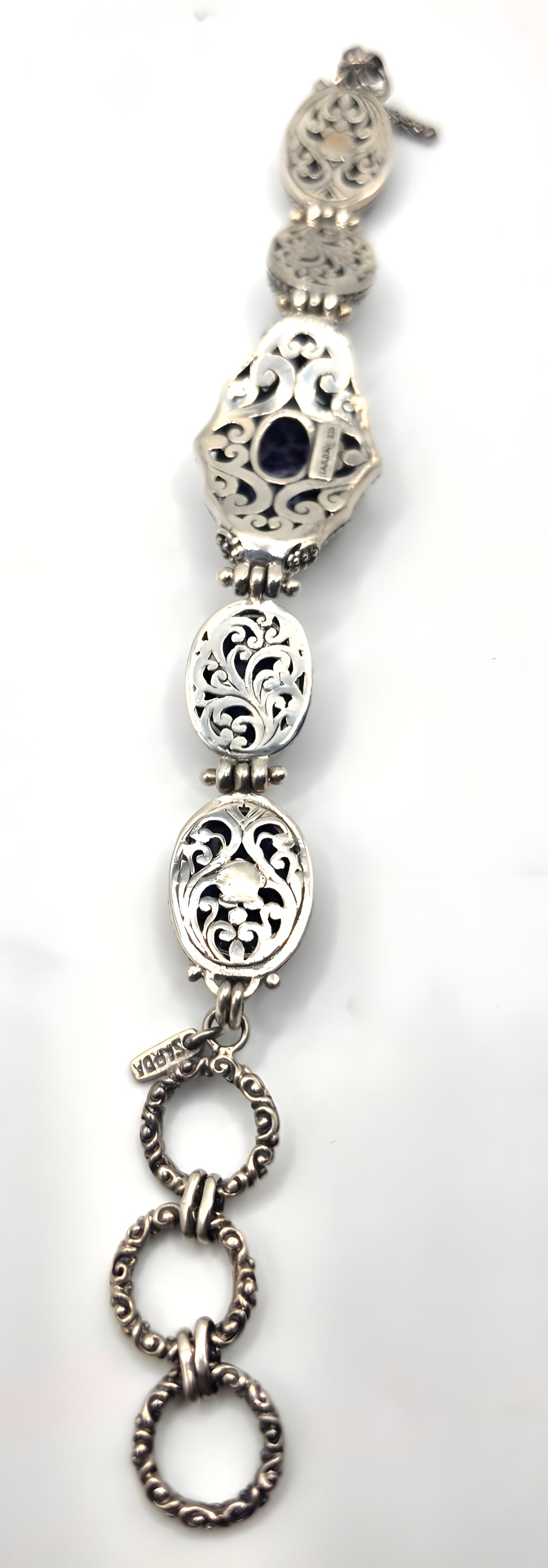 Beautiful SARDA sterling silver link bracelet featuring five oval purple cabocho
