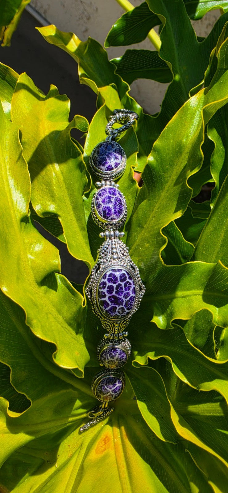 Beautiful SARDA sterling silver link bracelet featuring five oval purple cabocho